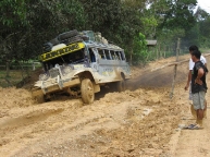 Jeepney going all in through the muddy path