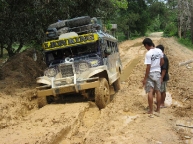 jeepney stuck in mud