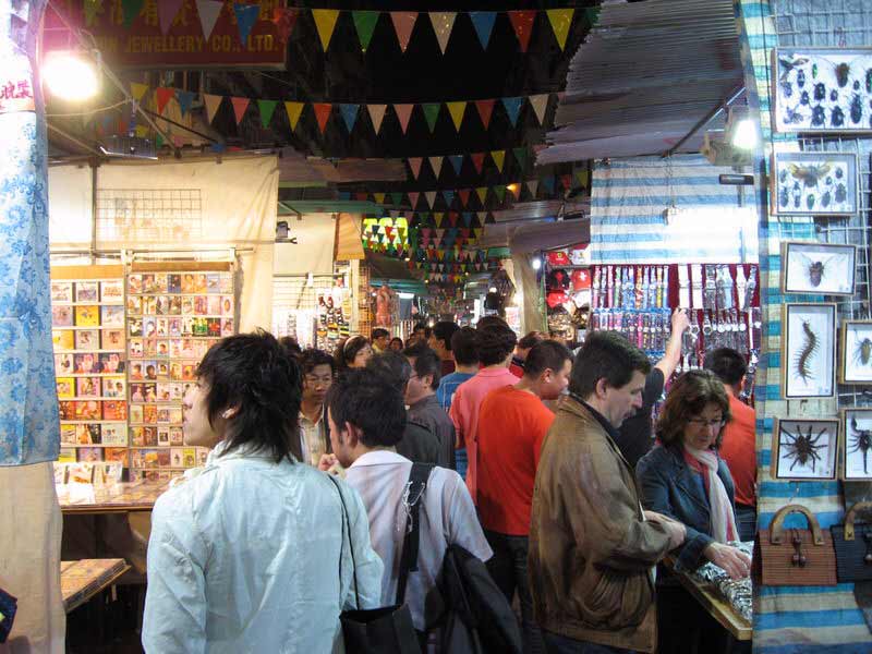 Clothes, shoes, watches, Mao era memorabilia in temple street market