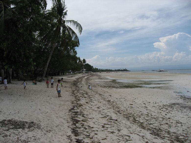 Filipino kids playing along the beach